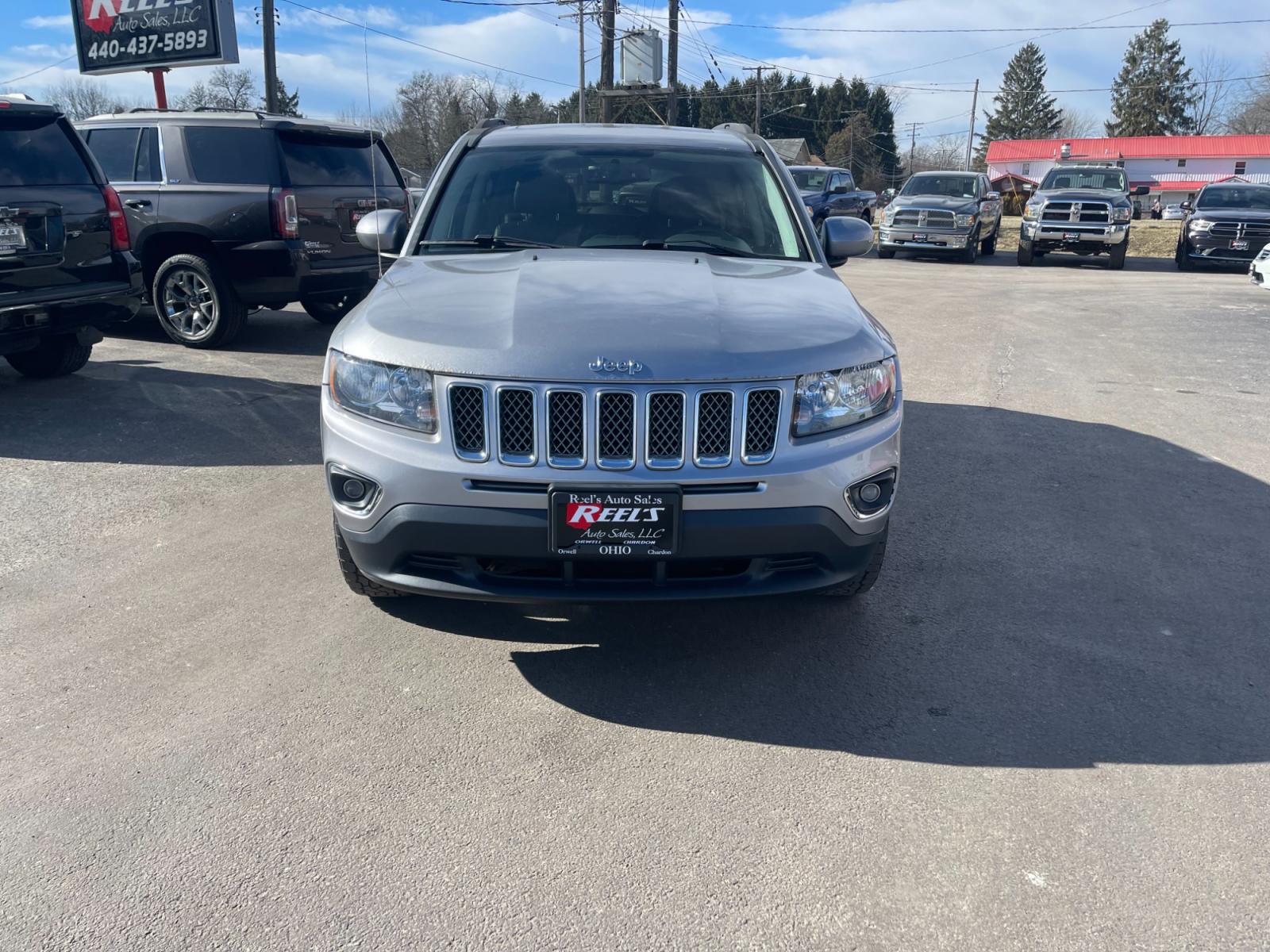 2015 Silver /Black Jeep Compass High Altitude 4WD (1C4NJDEB0FD) with an 2.4L I4 DOHC 16V engine, 6 Speed Automatic transmission, located at 547 E. Main St., Orwell, OH, 44076, (440) 437-5893, 41.535435, -80.847855 - Photo #1